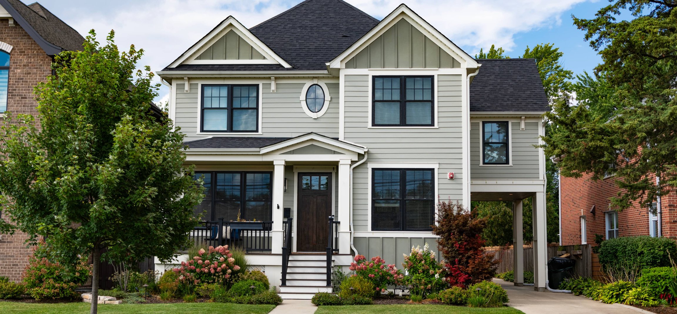 Home exterior with professional roofing and siding