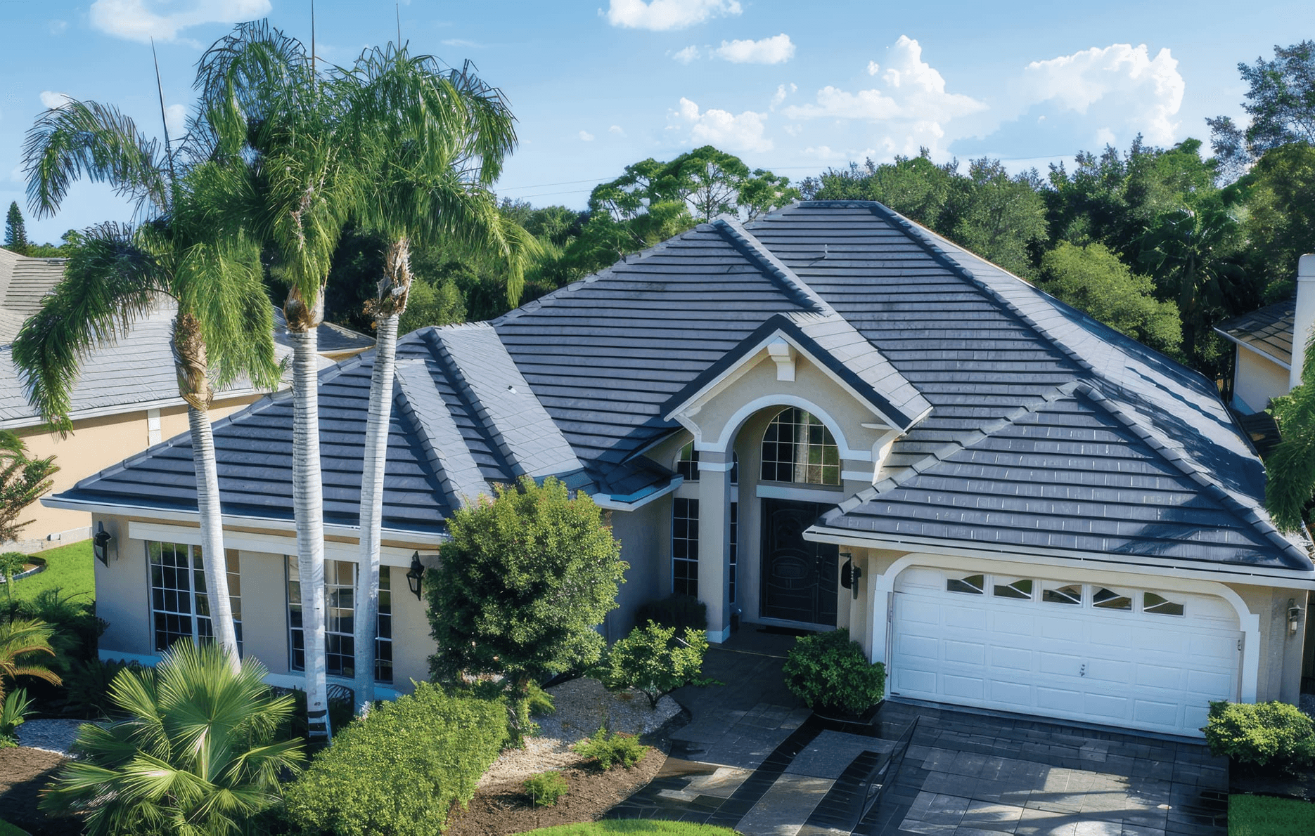 Home exterior with new roof and siding